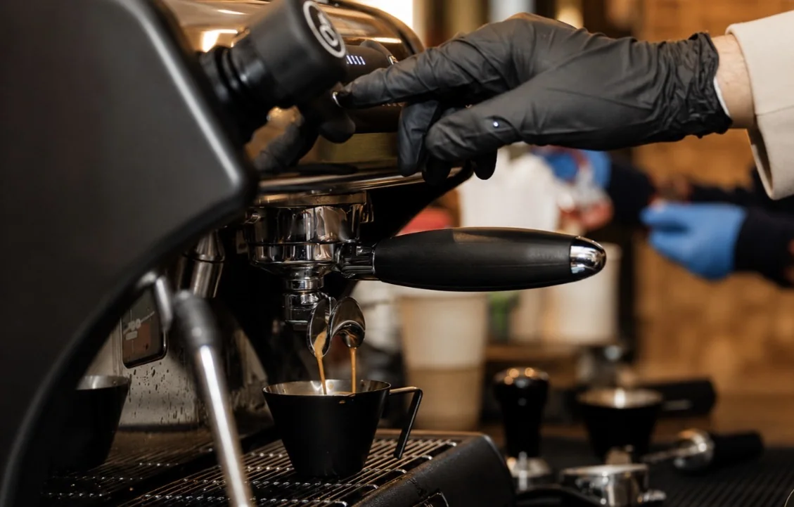 Fresh espresso being pulled by a Qahwa Al Quds barista